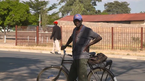 African man with bicycle Stock Footage 129291299