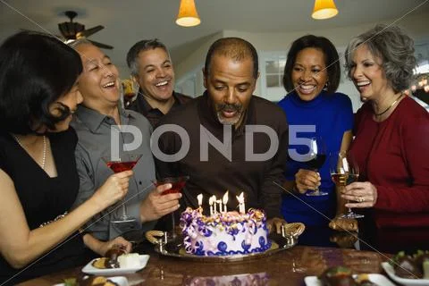 African Man Celebrating Birthday With Multi-Ethnic Friends