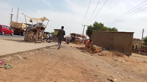 African Man Chopping Tree Stump For Firewood By Roadside Kano Nigeria 動画素材 329482532