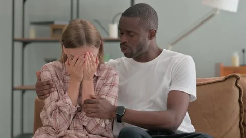 African Man Consoling Depressed Crying Wife at Home Video stock 287910162