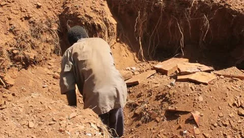 African Man Digging in a Rock Quarry  (HD) Stock Footage 10766552