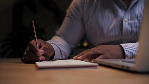 African man doing online learning at home.Business person work remotely using Stock Footage 209223505