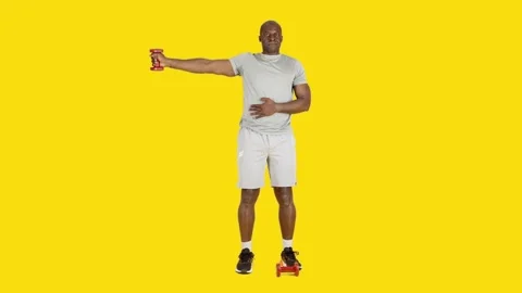 African man doing triceps lateral extension exercises with dumbbells Stock Footage 241729409