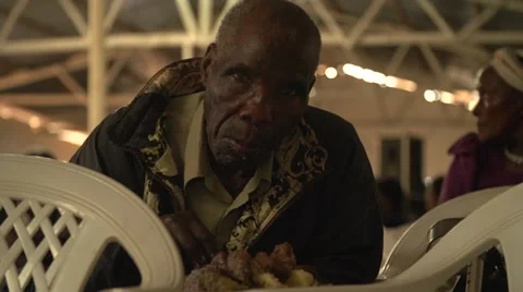 African Man Eating in Slow Motion, Uganda Stock Footage 40929281