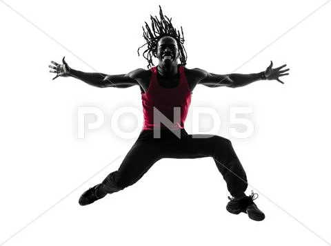 African man exercising fitness zumba dancing silhouette Stock Photos
