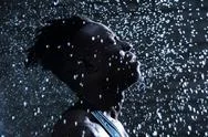 African Man Face Under Fresh Raindrops At Dark Night Stock Photos