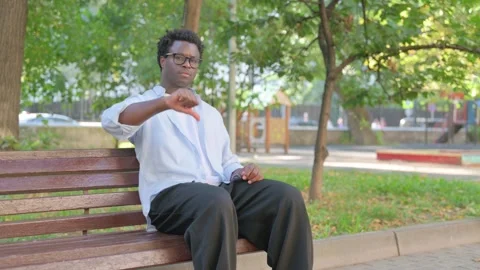 African Man Giving Thumbs Down at Camera Outdoor Vidéo 316822305