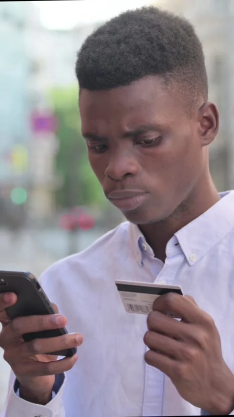 African Man having Online Payment Failure on Smartphone, Vertical Video Stock Footage 340024796