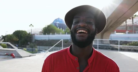 African man laughing in front of camera - Real people concept Stock Footage 141050732