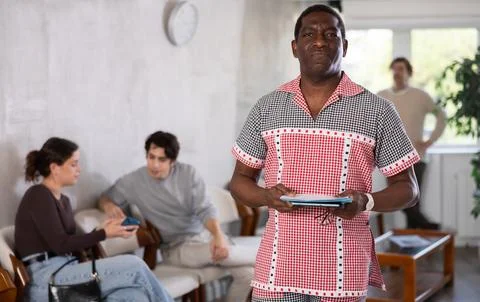African man in line for interview at reception Stock Photos