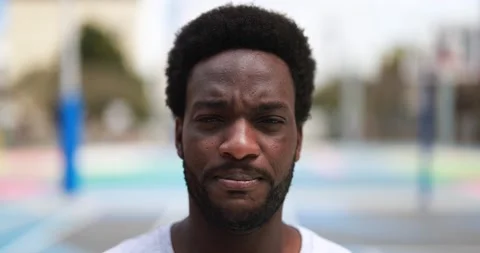 African man looking on camera in the city Stock Footage 183006748