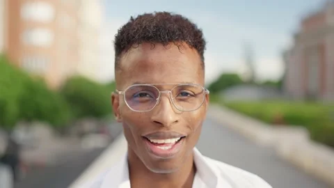 African man looks at camera and smiles Stock Footage 207455191
