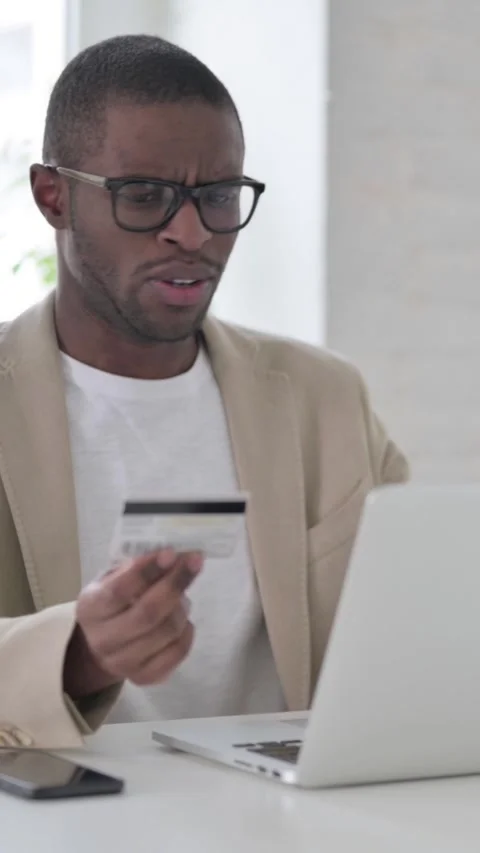 African Man making Online Payment Failure on Laptop in Office, Vertical Video Stock Footage 337350041