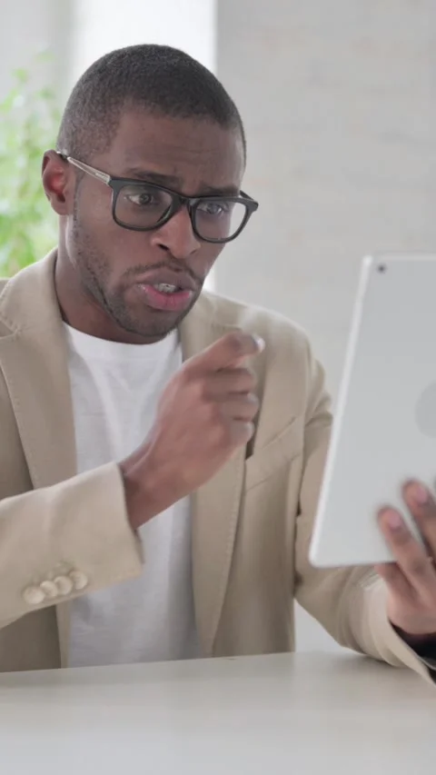 African Man making Video Call on Tablet in Office, Vertical Video Stock Footage 337350091
