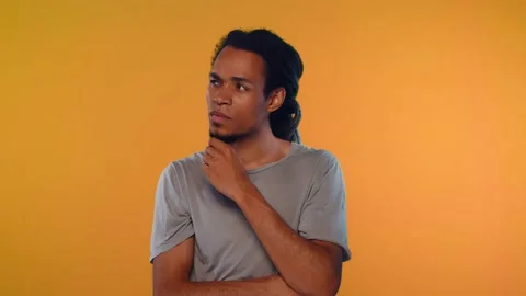 African man with pensive expression, comes up solution to complex problem Stock Footage 140279404