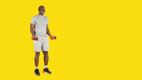 African man performing curl biceps with dumbbells Stock Footage 241731698