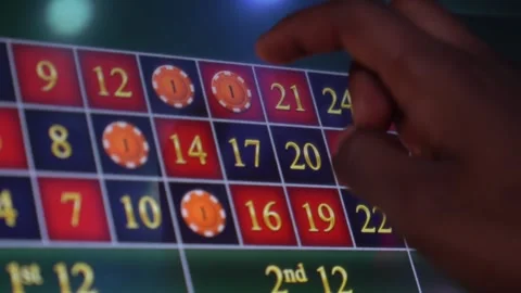 African man playing a game of roulette on a slot machine Stock Footage 256794503