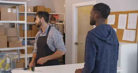 African man at post office receiving parcel Stock Footage 160480054
