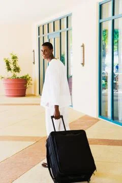 African man pulling suitcase Stock Photos