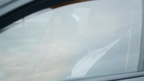 African man rolling window down at car. Closeup african man sitting in car. Stock Footage 128063385