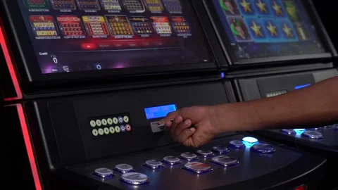African man selecting a slot machine game at a casino 스톡 동영상 256793616