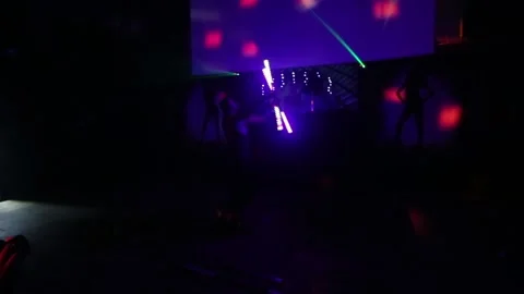 African man shows a performance with fluorescent lights in a nightclub. Stock Footage 86269945