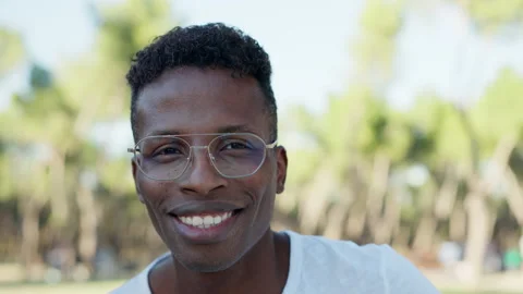 An african man smiling at the camera Stock Footage 221606123