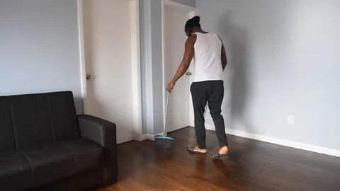 African man sweep Stock Footage 128849524