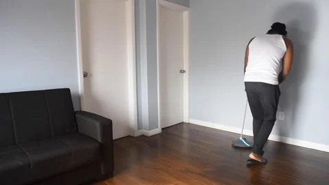 African man sweep Stock Footage 128849558