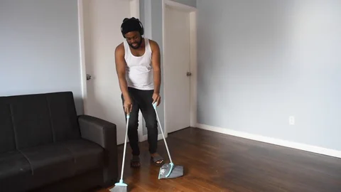 African man sweep Stock Footage 128849559