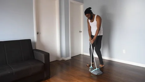 African man sweep Stock Footage 128849560