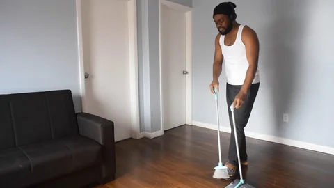 African man sweep Stock Footage 128849582