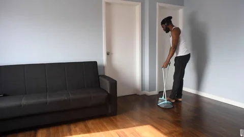 African man sweep Stock Footage 128849599