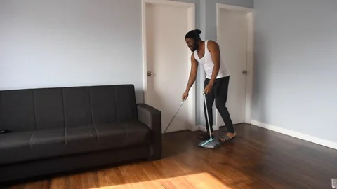 African man sweep Stock Footage 128849617