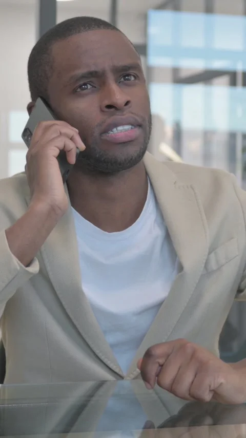 African Man Talking on phone, Doing Negotiation, vertical video Video stock 324792450