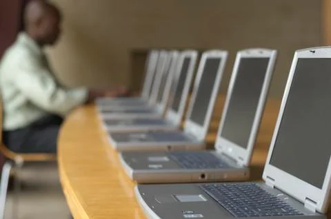 African man using laptop at computer lab Stock Photos