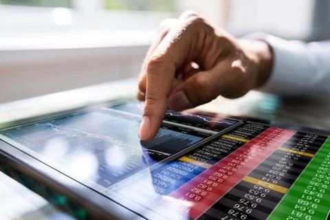 African Man Using Stock Market Data Stock Photos