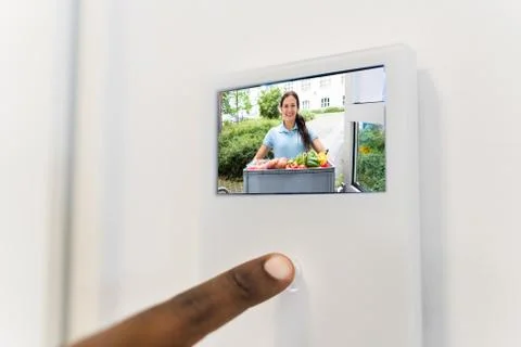 African Man Using Video Intercom System Stock Photos