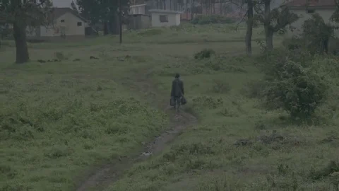 African man walking down a path. Видео 69215662