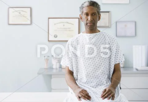 African man wearing hospital gown Stock Photos