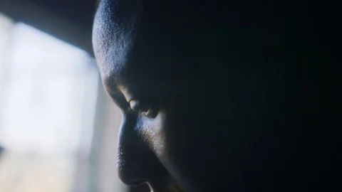 African man in windowlight Stock Footage 79646802