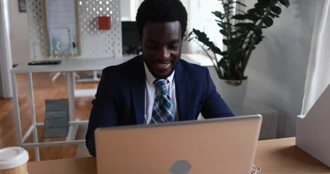 African man working inside office using computer laptop Stock Footage 155332010