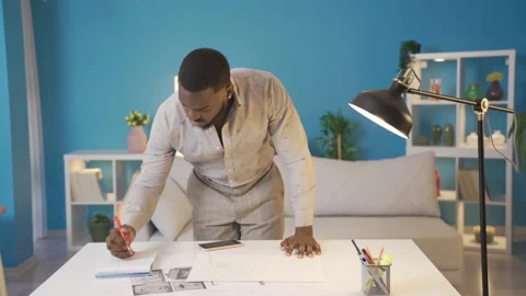 African man working on project at his home. Video stock 228804492