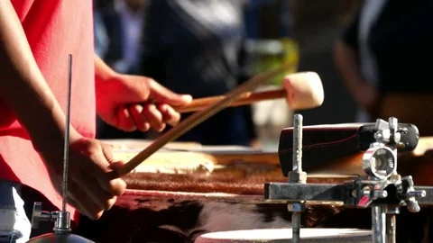 African man's arms &amp; hands with mallet hitting animal hair covered drums  動画素材 80342199