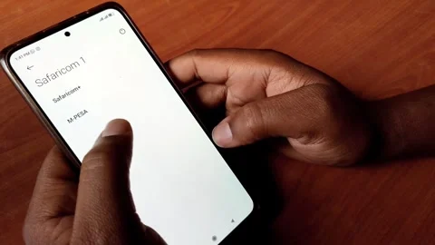 African Man's Hands Using Mpesa Send Money Stock Footage 255951835