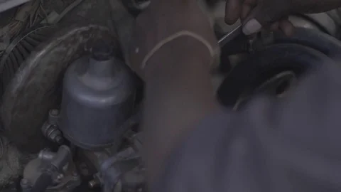 African mechanic changes engine parts, close up. Stock-Footage 82327448