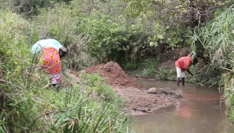 African Men Digging for Sand in Polluted Stream (HD) Stock Footage 7377957