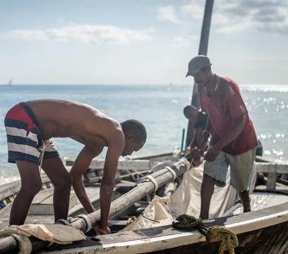 African men working on boat with sail Stock Photos