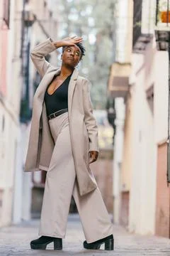 African model posing while standing on the street Stock Photos