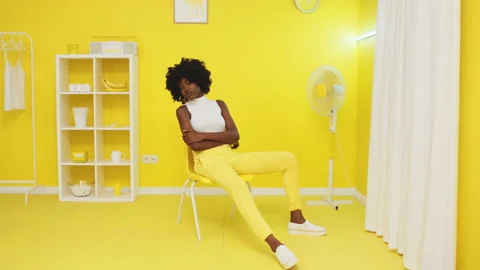 African Model In Yellow Room Stock Footage 150105947